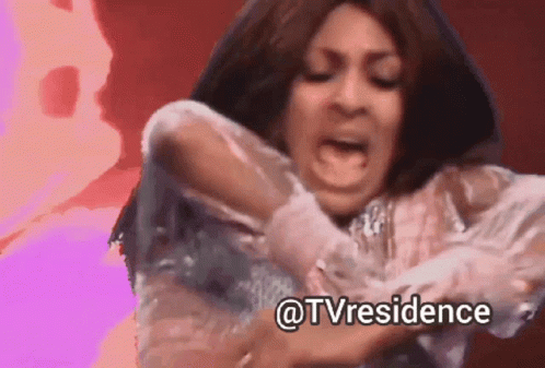 Woman In White Dress Making Funny Face GIF