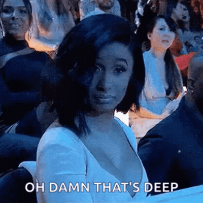 Woman In White Dress Making Funny Face In Crowd GIF