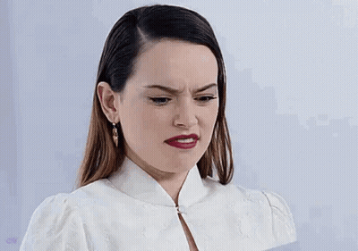 Woman In White Dress Making Funny Face GIF