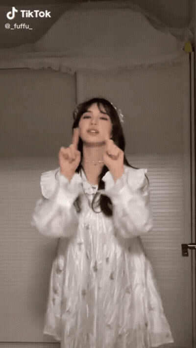 Woman In White Dress Making Heart GIF