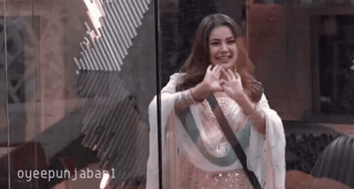 Woman In White Dress Making Heart Shape GIF