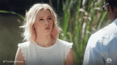 Woman In White Dress Next To Man In Blue Shirt GIF