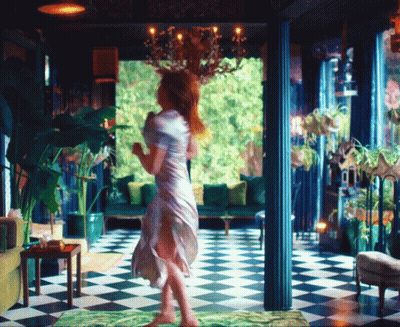 Woman In White Dress On Checkered Floor GIF