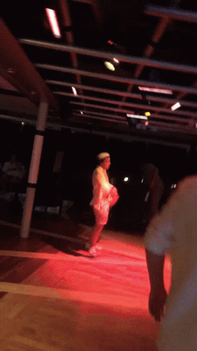 Woman In White Dress On Red Stage GIF