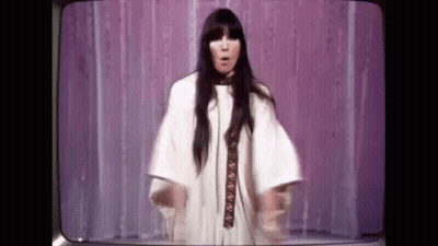 Woman In White Dress On Stage With Television GIF