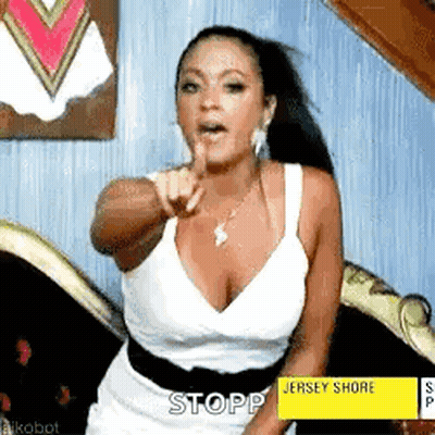 Woman In White Dress Pointing GIF
