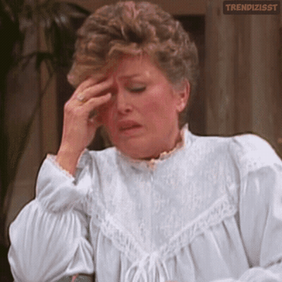 Woman In White Dress Rubbing Forehead GIF