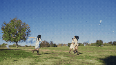 Woman In White Dress Running In Field GIF