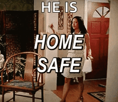 Woman In White Dress Saying He Is Home Safe GIF