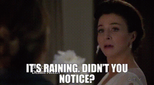 Woman In White Dress Saying It's Raining GIF