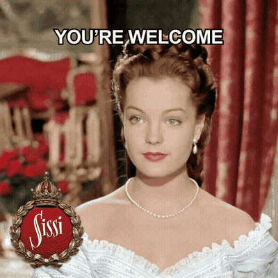 Woman In White Dress Saying Youre Welcome GIF