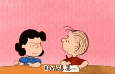 Woman In White Dress Says Bam By Chain Link Fence GIF