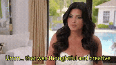 Woman In White Dress Says Umm Thoughtful And Creative GIF