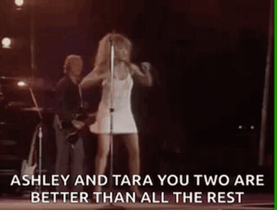 Woman In White Dress Singing Into Microphone GIF