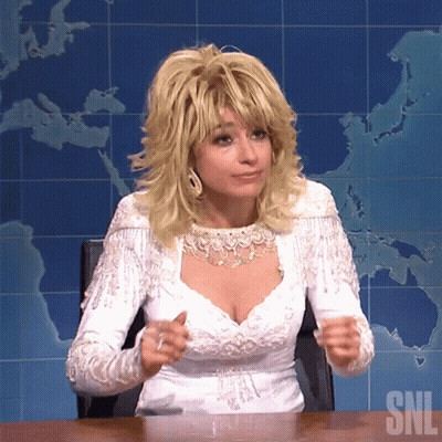 Woman In White Dress Sitting At Desk SNL GIF