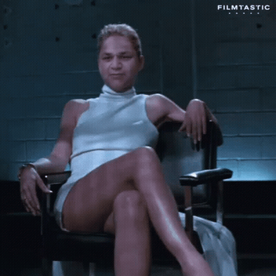 Woman In White Dress Sitting Cross-Legged GIF