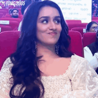Woman In White Dress Sitting In Red Seats Toms 2005 GIF