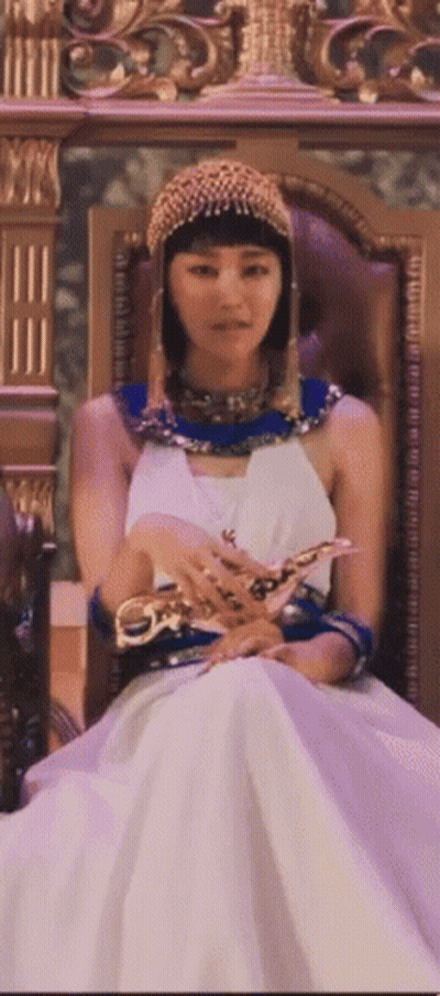 Woman In White Dress Sitting In Throne GIF