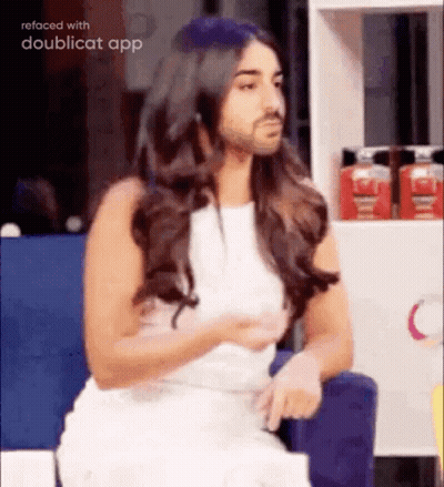 Woman In White Dress Sitting With Bearded Man GIF