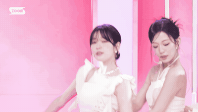 Woman In White Dress Smiling Next To Two Women GIF