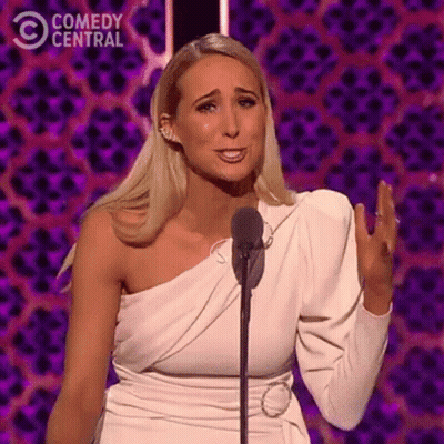 Woman In White Dress Speaking Into Microphone GIF