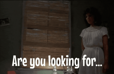 Woman in White Dress Standing at Window Saying Are You Looking For