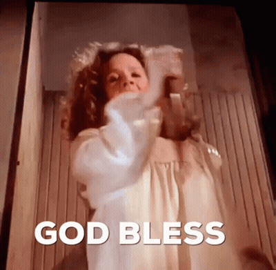 Woman In White Dress Standing By God Bless Door GIF