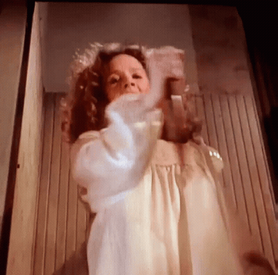 Woman In White Dress Standing In Front Of Door GIF