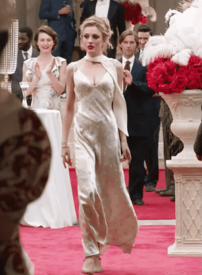 Woman In White Dress Walking Down Red Carpet GIF