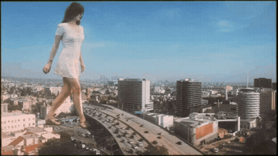 Woman In White Dress Walking Over Highway In City GIF