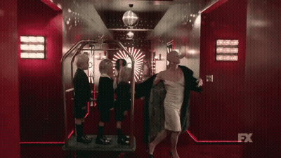 Woman In White Dress With Children And FX Sign GIF
