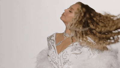 Woman In White Dress With Feathers And Rhinestones GIF