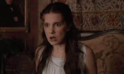 Woman In White Dress With Funny Face GIF