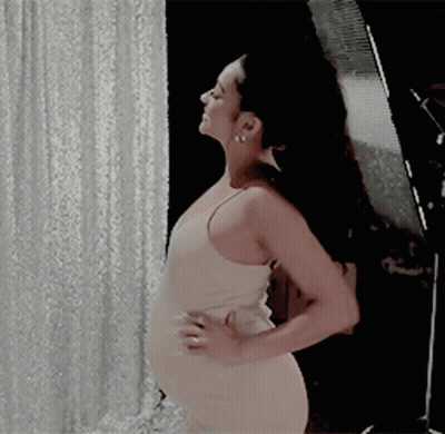 Woman In White Dress With Hands On Hips GIF