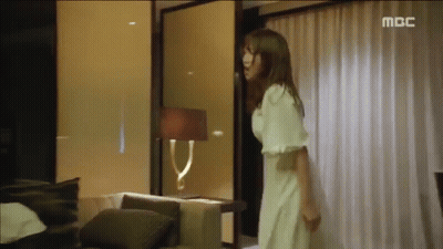 Woman In White Dress With MBC Logo GIF
