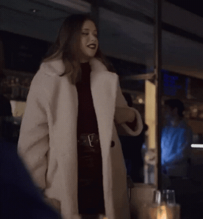 Woman In White Fur Coat By Window GIF