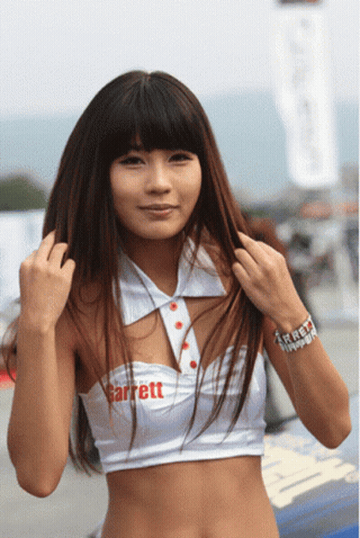 Woman In White Garrett Top Holding Hair GIF