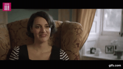 Woman In White Garrett Top Holding Hair GIF