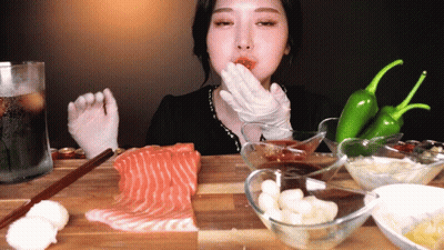 Woman In White Gloves Eating Salmon GIF