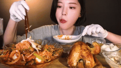 Woman In White Gloves Eating With Spoon GIF