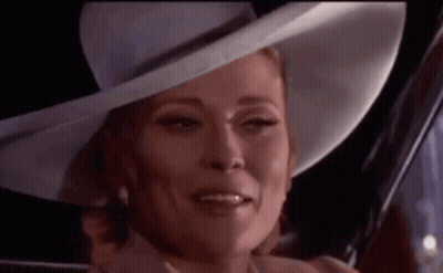 Woman In White Hat And Pearls Smiling GIF