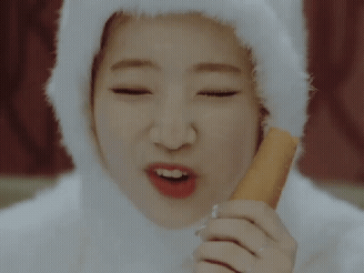 Woman In White Hat Eating Carrot Stick GIF