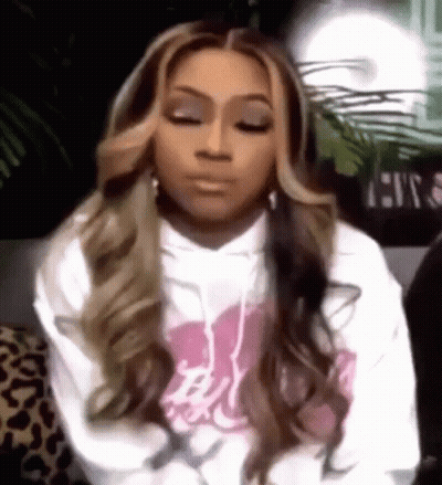 Woman In White Hoodie Sitting With Eyes Closed GIF