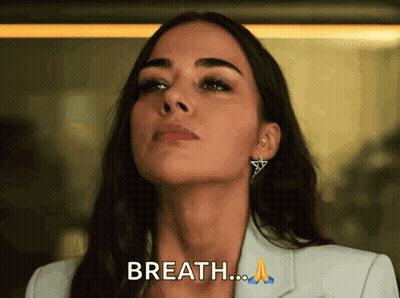 Woman In White Jacket And Earrings Saying Breath GIF