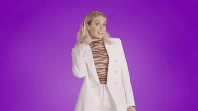 Woman In White Jacket And Tiger Print Turtleneck GIF