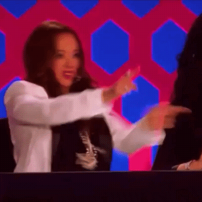 Woman In White Jacket Dancing On Stage GIF