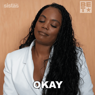 Woman In White Jacket Saying Okay GIF