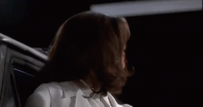 Woman In White Lab Coat Sitting In Car GIF
