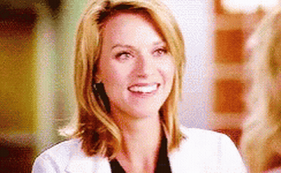Woman in White Lab Coat Smiling