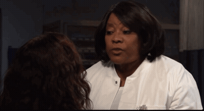 Woman In White Lab Coat Talking To Woman GIF